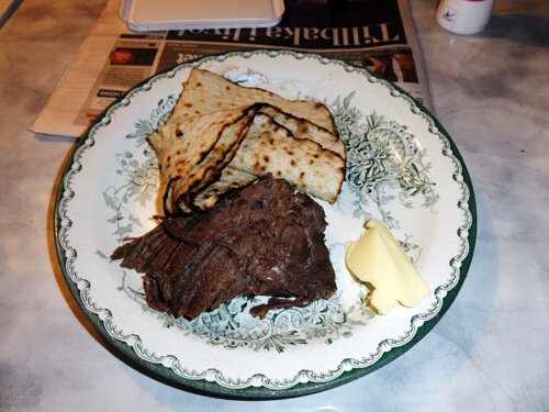 Flat bread, boiled moose meat, and cheese.
