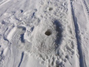 old ice fishing hole